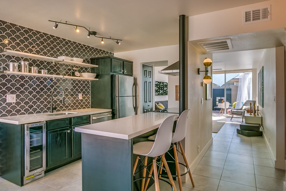 Mid-sized midcentury kitchen in Phoenix with an undermount sink, shaker cabinets, green cabinets, terrazzo benchtops, grey splashback, porcelain splashback, stainless steel appliances and with island.