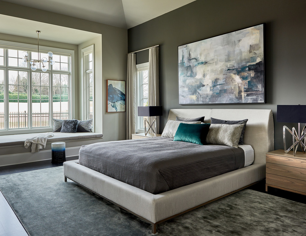 This is an example of a transitional bedroom in Charlotte with grey walls, dark hardwood floors and black floor.