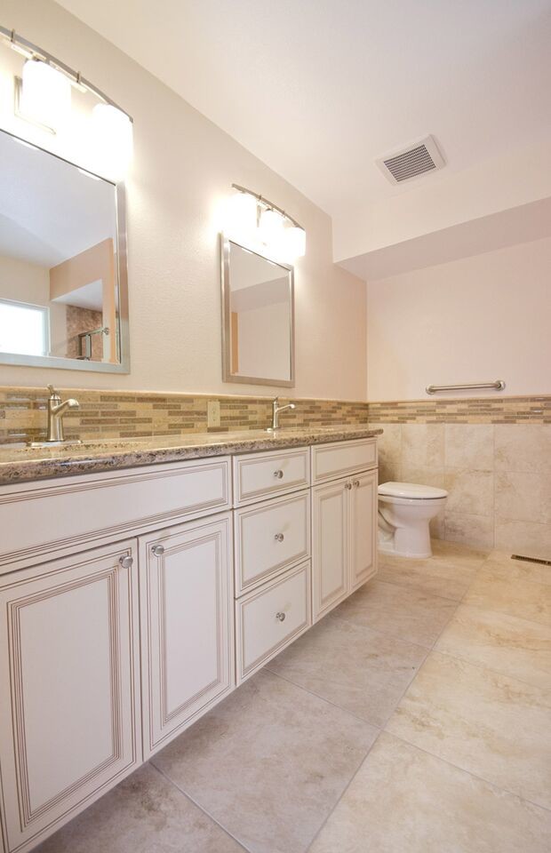 Design ideas for a traditional master bathroom in Other with beaded inset cabinets, white cabinets, an alcove shower, a two-piece toilet, beige tile, multi-coloured tile, matchstick tile, white walls, linoleum floors, an undermount sink and granite benchtops.