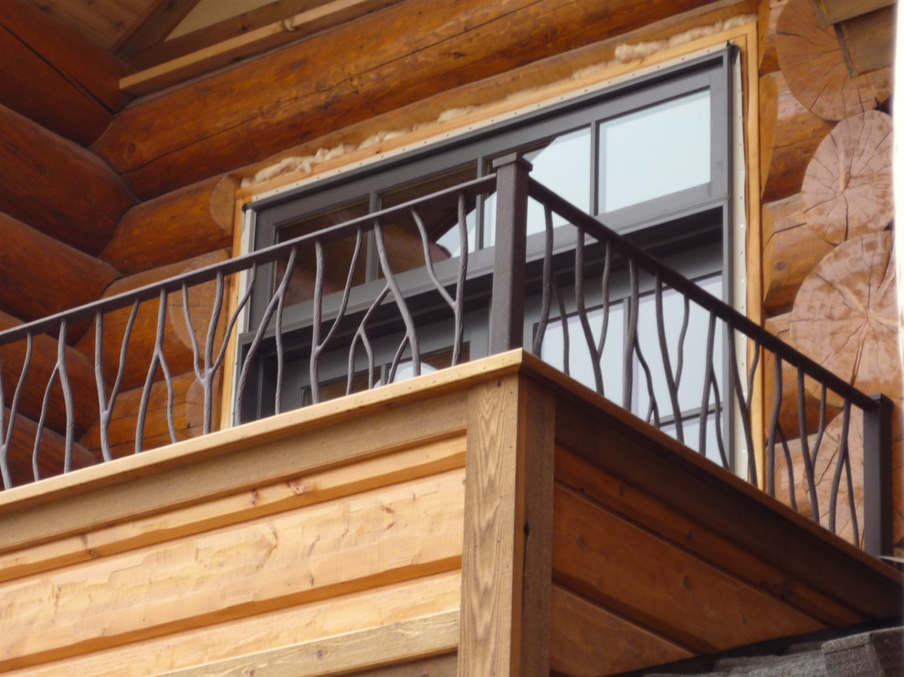 Inspiration for a large rustic two-story wood brown staircase remodel with a shingle roof