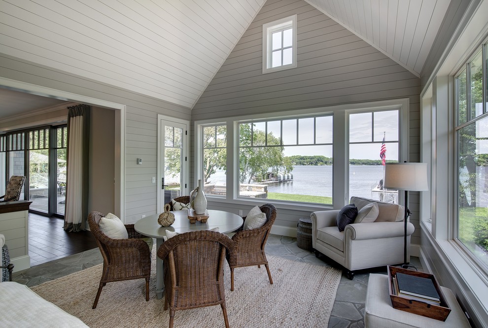This is an example of a beach style sunroom in Minneapolis.