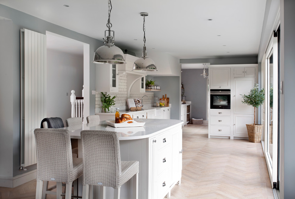 This is an example of a mid-sized transitional kitchen in Dublin.