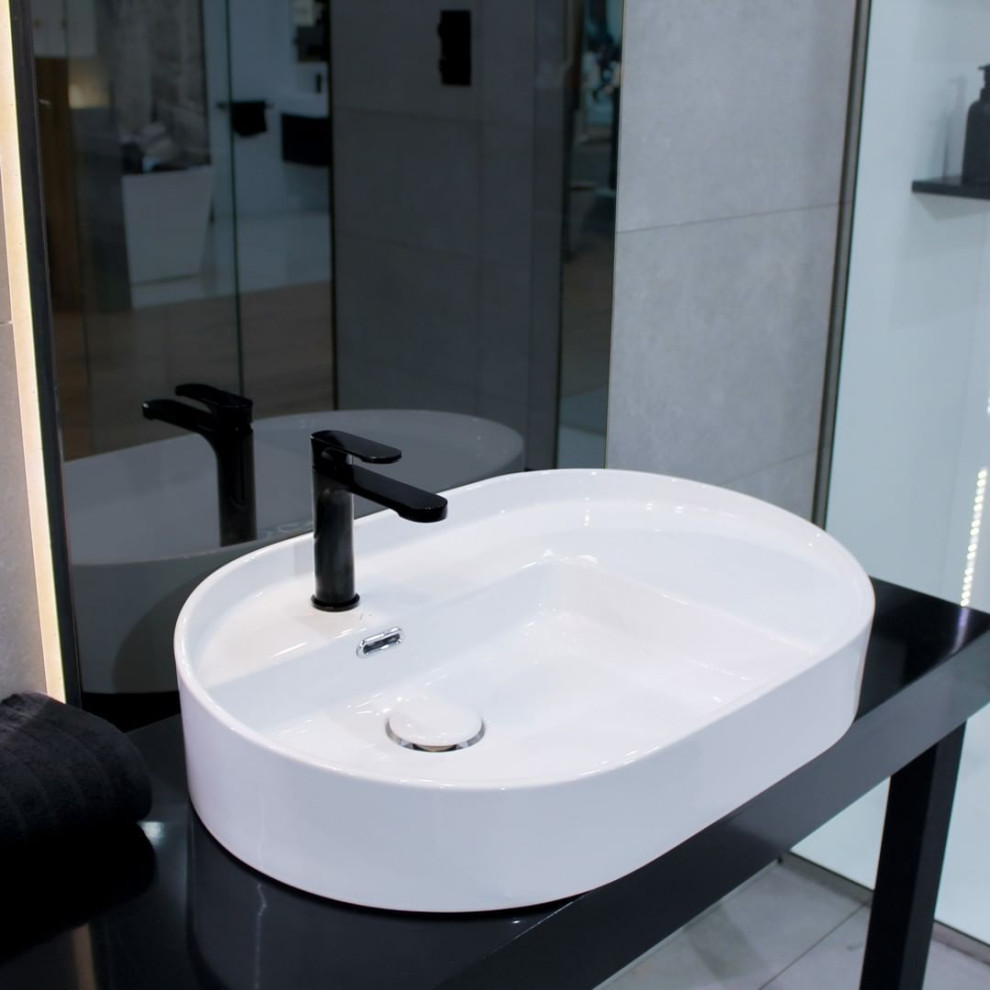 Inspiration for a modern bathroom in Marseille with black walls, a vessel sink, laminate benchtops, beige floor, black benchtops, a single vanity and a freestanding vanity.