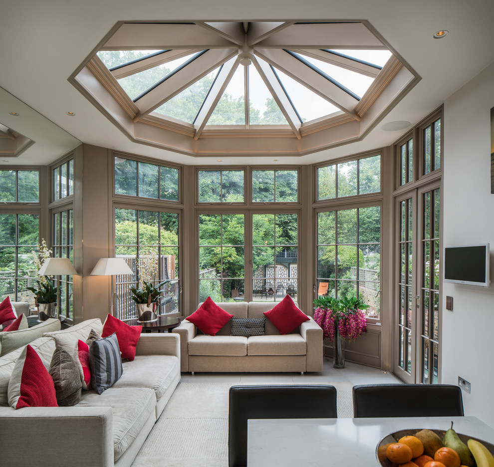 Mid-sized traditional sunroom in London with a skylight.