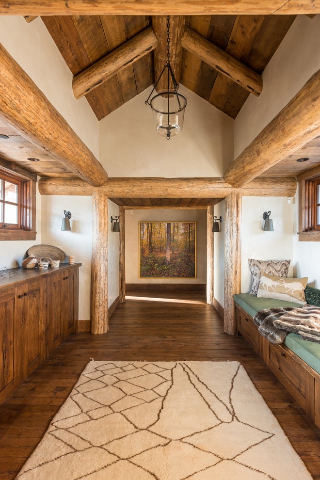 Mountain style medium tone wood floor hallway photo with white walls