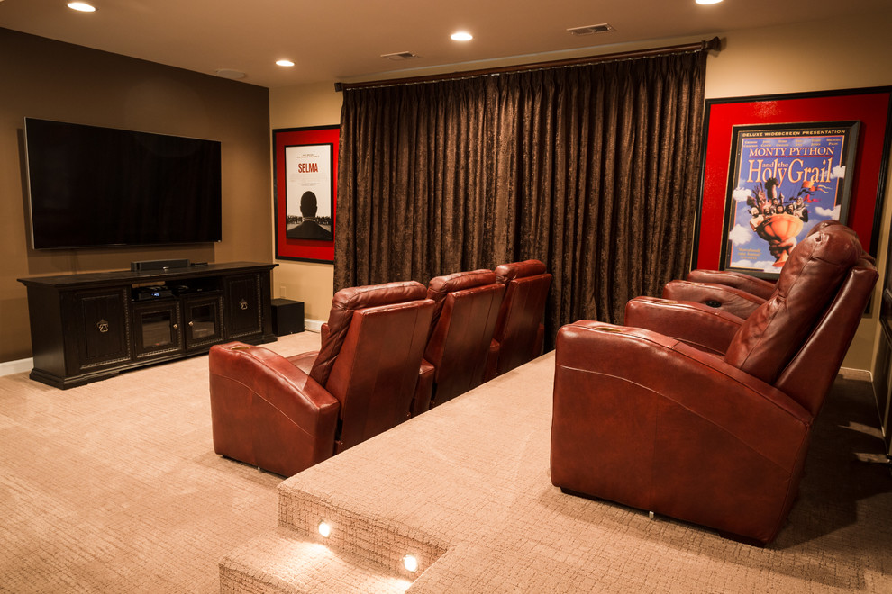 This is an example of a small transitional open concept home theatre in DC Metro with brown walls, carpet, a wall-mounted tv and beige floor.