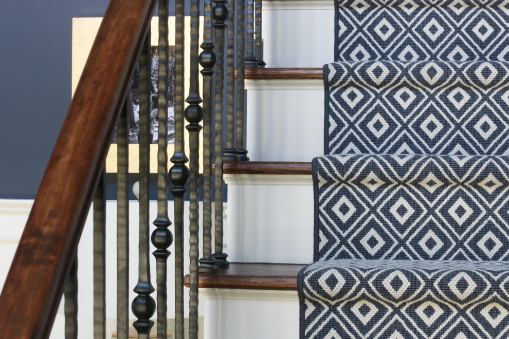 Inspiration for a large timeless medium tone wood floor foyer remodel in New York with blue walls and a white front door