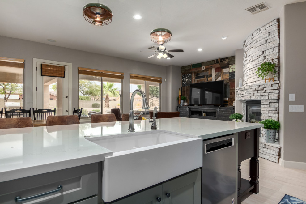 Inspiration for a huge rustic l-shaped eat-in kitchen remodel in Phoenix with a farmhouse sink, shaker cabinets, gray cabinets, quartz countertops, blue backsplash, subway tile backsplash, an island and white countertops