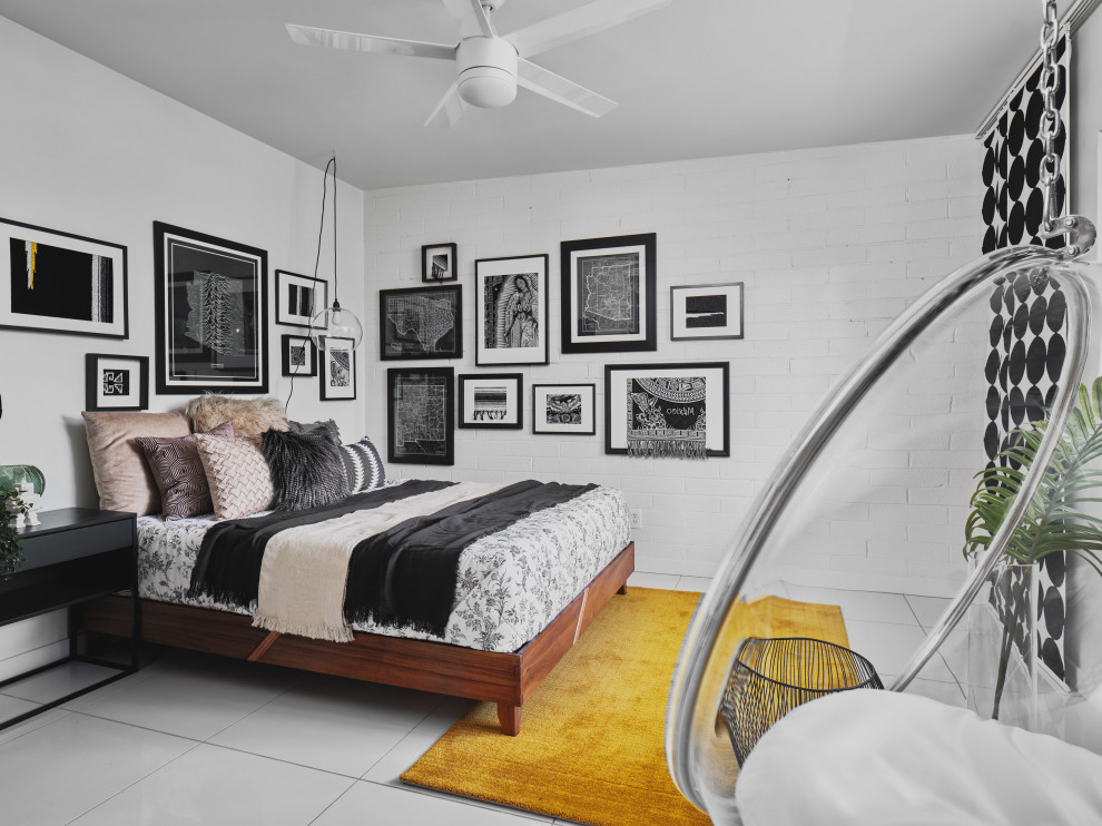 Photo of a mid-sized contemporary kids' room for girls in Phoenix with white walls, white floor and brick walls.