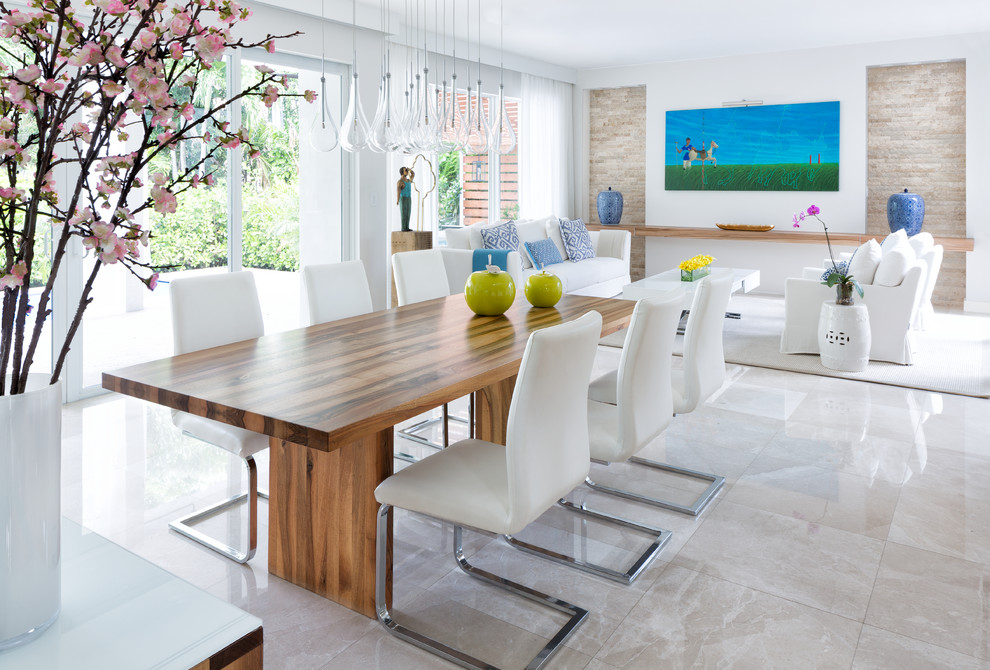 Design ideas for a large beach style open plan dining in Miami with grey walls, marble floors, no fireplace and beige floor.