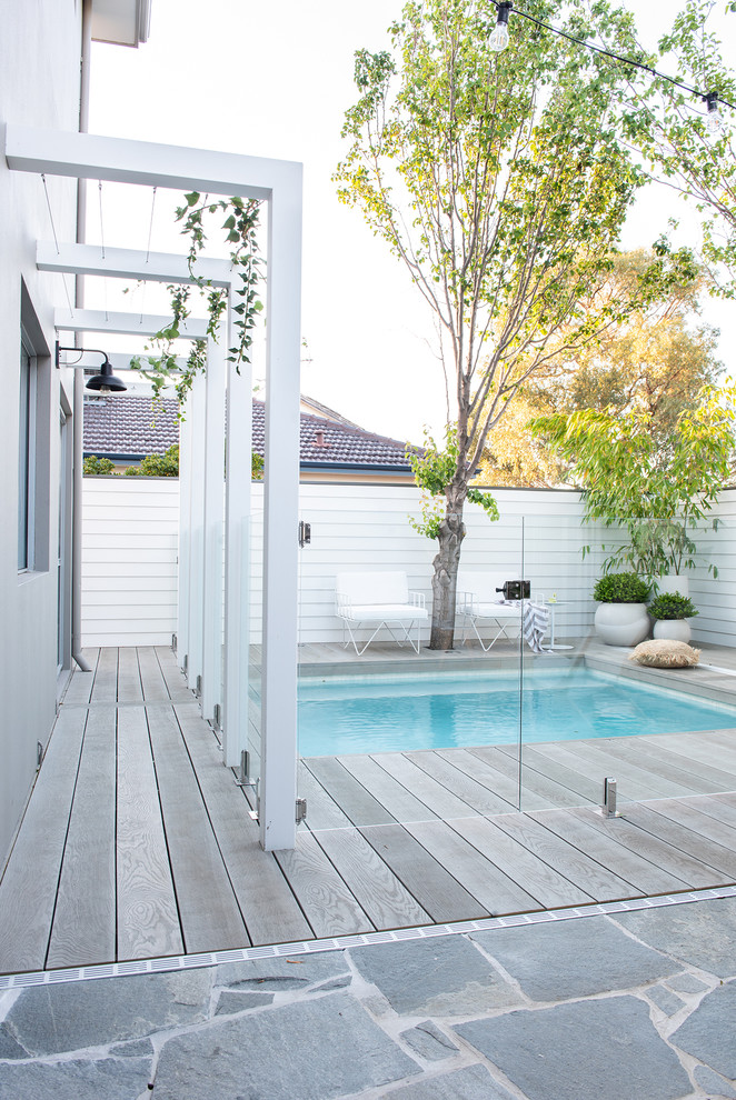 Inspiration for a small beach style backyard pool in Perth with decking.