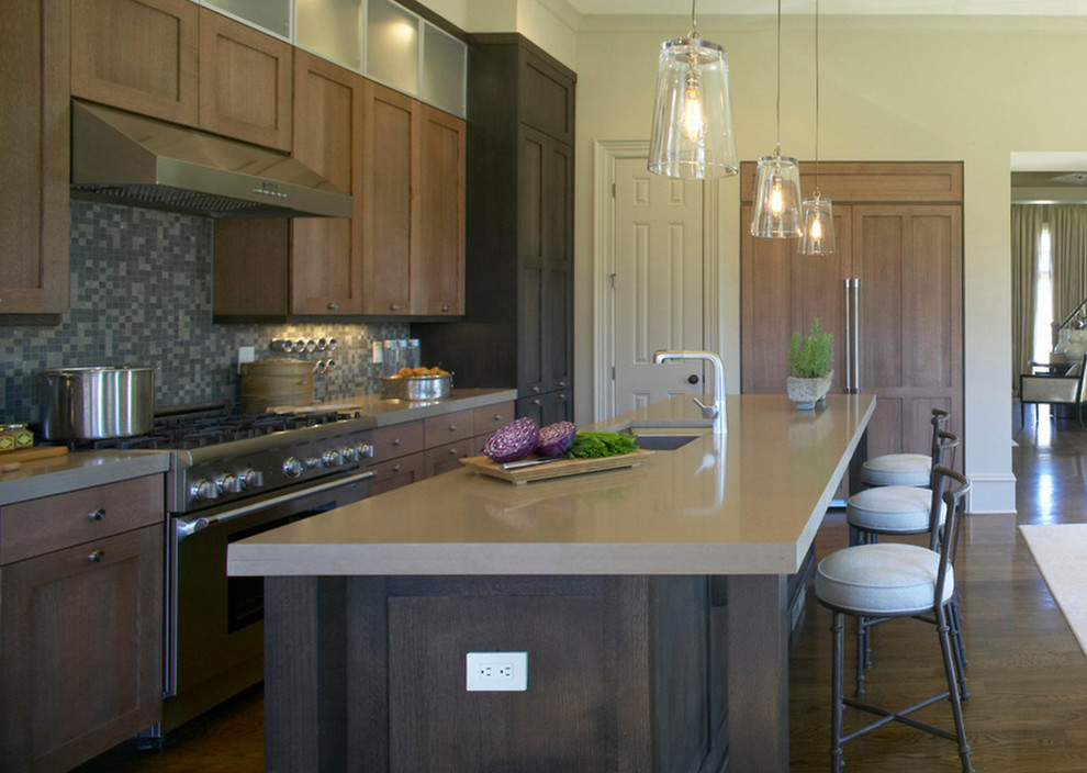 Mid-sized transitional galley dark wood floor and brown floor eat-in kitchen photo in Phoenix with an undermount sink, shaker cabinets, dark wood cabinets, quartz countertops, gray backsplash, mosaic tile backsplash, stainless steel appliances and an island