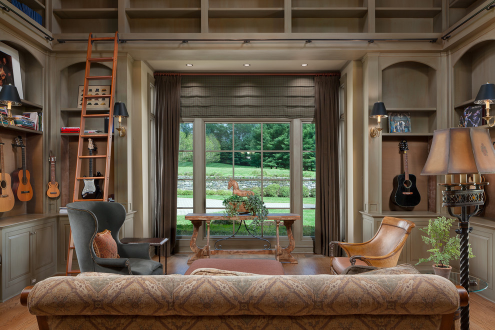 Inspiration for a country enclosed family room in New York with a music area, grey walls and medium hardwood floors.