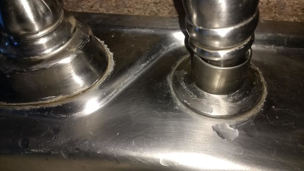Hard to remove residue around stainless kitchen stink faucet?