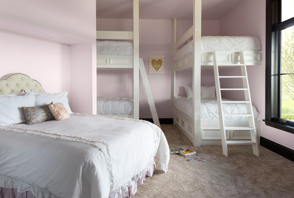 Example of a mountain style carpeted bedroom design in Denver with pink walls