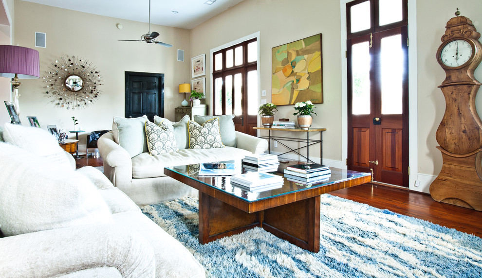 Eclectic living room in Charleston with beige walls.