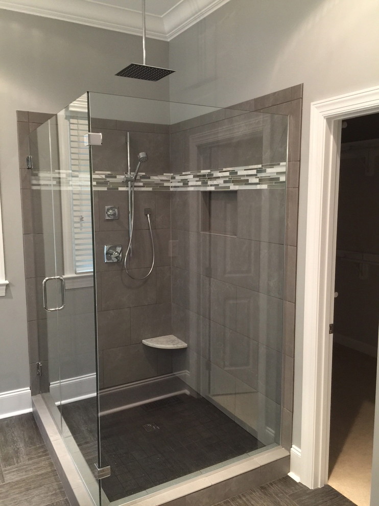 Photo of a large contemporary master bathroom in Raleigh with flat-panel cabinets, grey cabinets, granite benchtops, gray tile, cement tile, a corner shower, an undermount sink, grey walls and ceramic floors.
