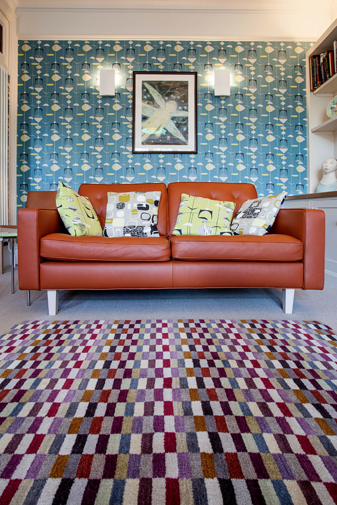 Design ideas for a midcentury living room in Oxfordshire with blue walls and carpet.