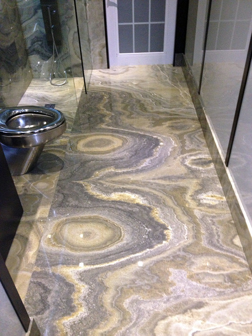Design ideas for a 3/4 bathroom in Miami with stone slab and marble floors.