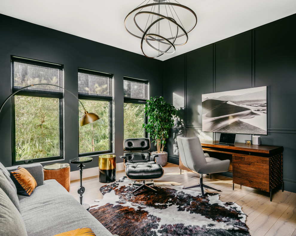 Study room - large contemporary freestanding desk light wood floor, wall paneling and beige floor study room idea in San Francisco with black walls