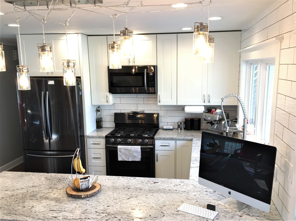 Open concept kitchen - mid-sized contemporary u-shaped porcelain tile and gray floor open concept kitchen idea in Baltimore with an undermount sink, shaker cabinets, white cabinets, granite countertops, white backsplash, ceramic backsplash, stainless steel appliances and a peninsula