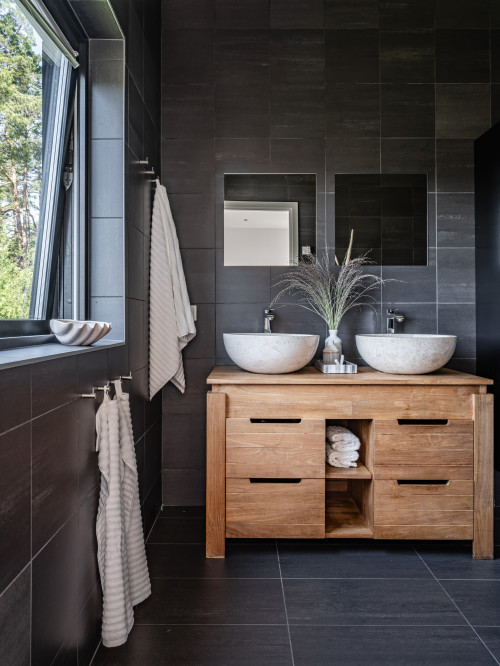 Black Tile Backsplash with Vessel Sinks and Frameless Mirrors