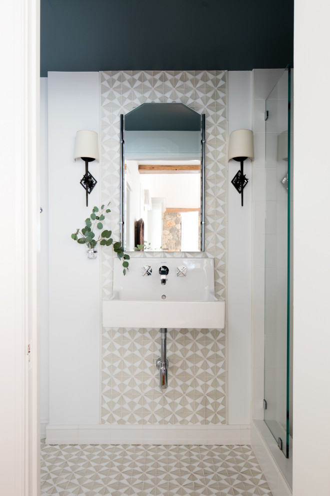 Inspiration for a small transitional master bathroom in Los Angeles with white cabinets, gray tile, white walls, mosaic tile floors, white floor, an open shower, an alcove shower, a wall-mount sink and a single vanity.