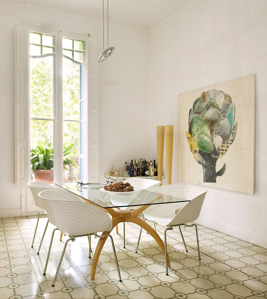 Inspiration for a mid-sized mediterranean separate dining room in Florence with white walls.