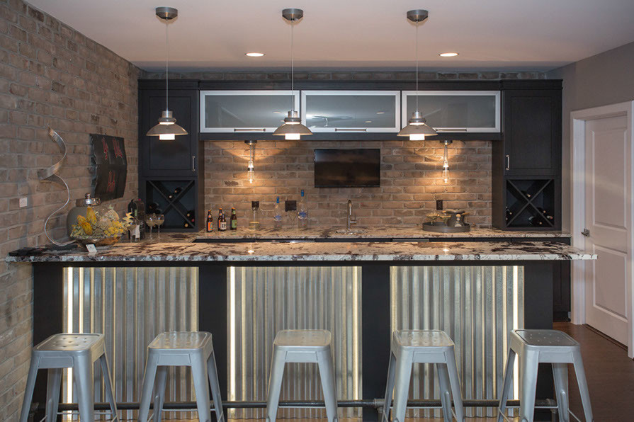 Mid-sized modern home bar in Cincinnati with granite benchtops and cork floors.