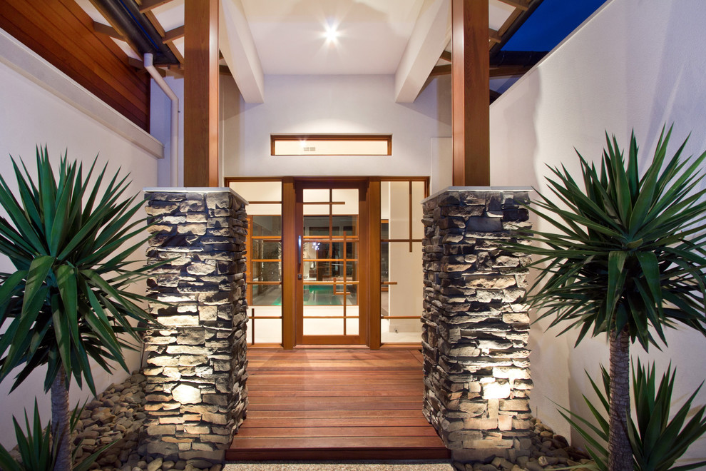 Design ideas for a tropical entryway in Melbourne.