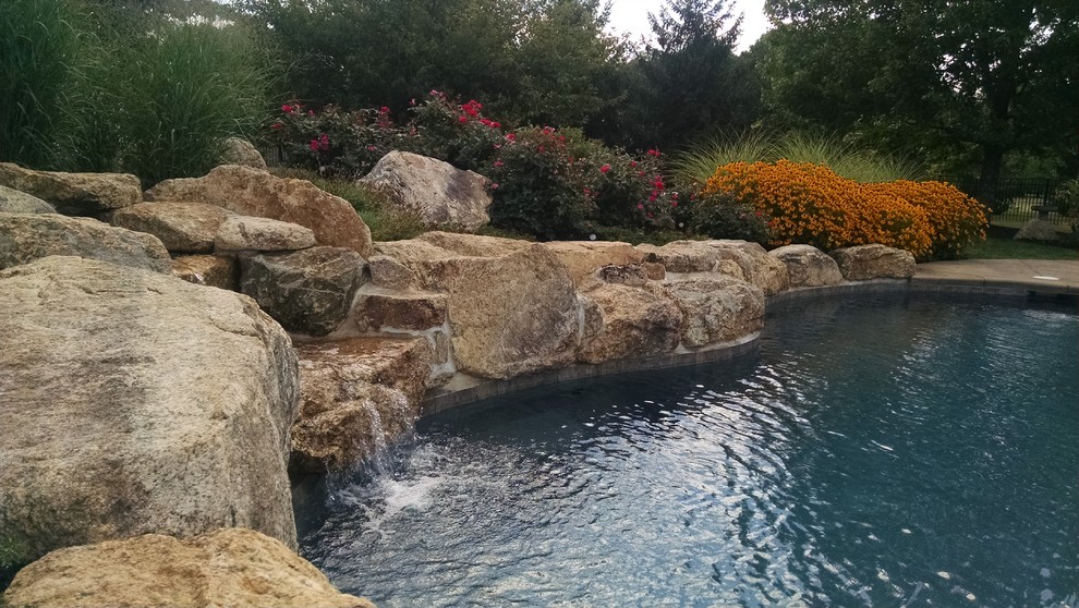 Mountain style backyard custom-shaped pool photo in New York