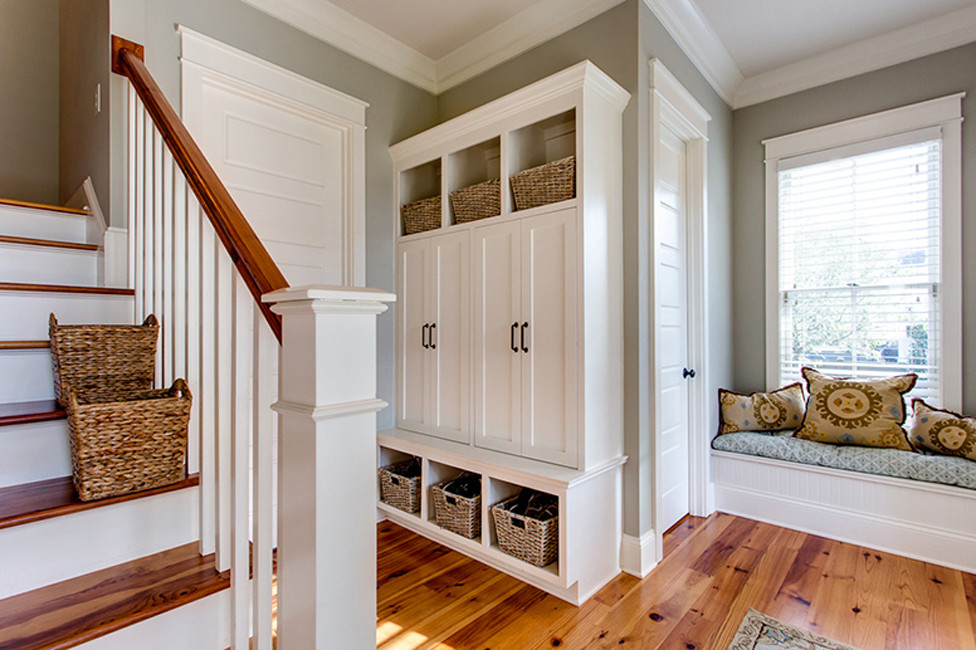 This is an example of a traditional wood staircase in Charleston with painted wood risers.