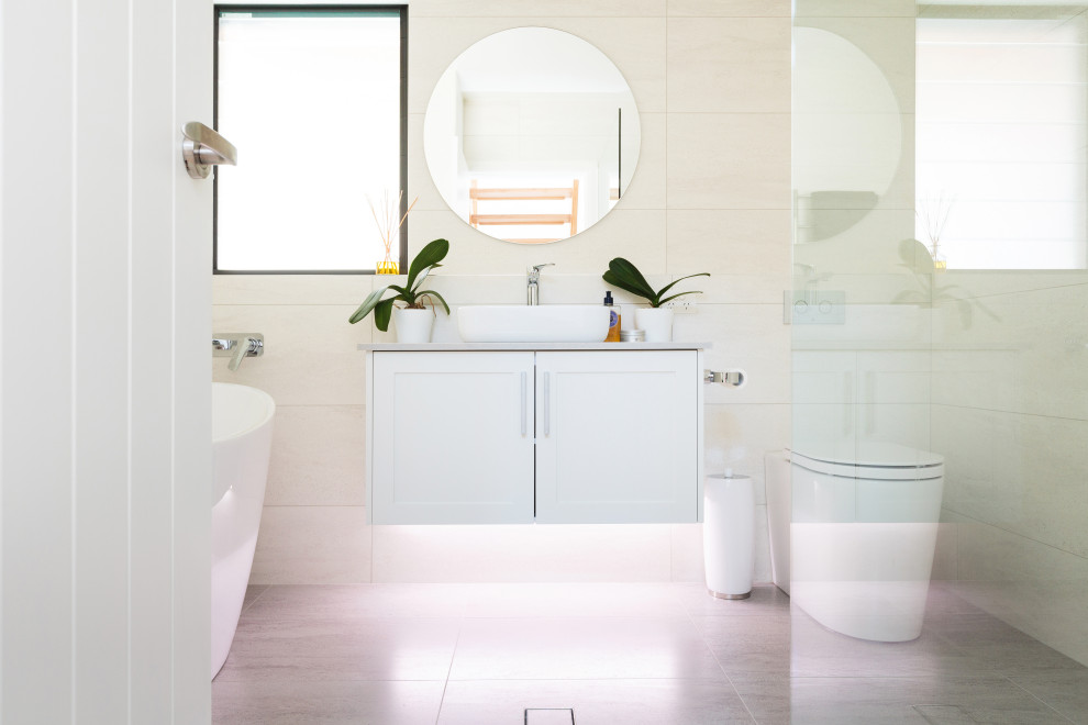 Design ideas for a contemporary bathroom in Newcastle - Maitland with shaker cabinets, white cabinets, an alcove shower, a vessel sink, grey floor and beige benchtops.