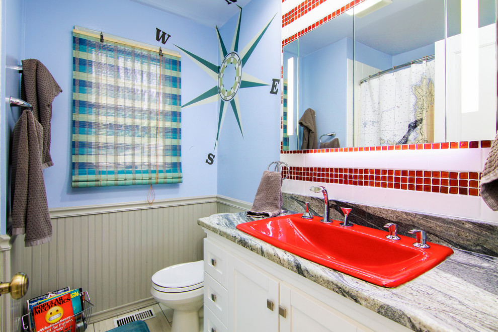 Photo of a mid-sized beach style bathroom in Baltimore with white cabinets, a shower/bathtub combo, a one-piece toilet, blue walls, ceramic floors, a drop-in sink, beige floor, a shower curtain, shaker cabinets, a drop-in tub, red tile, glass tile and grey benchtops.