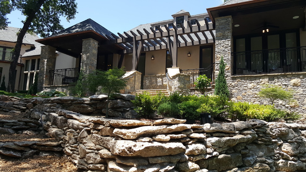 Mid-sized mountain style beige one-story mixed siding gable roof photo with a shingle roof