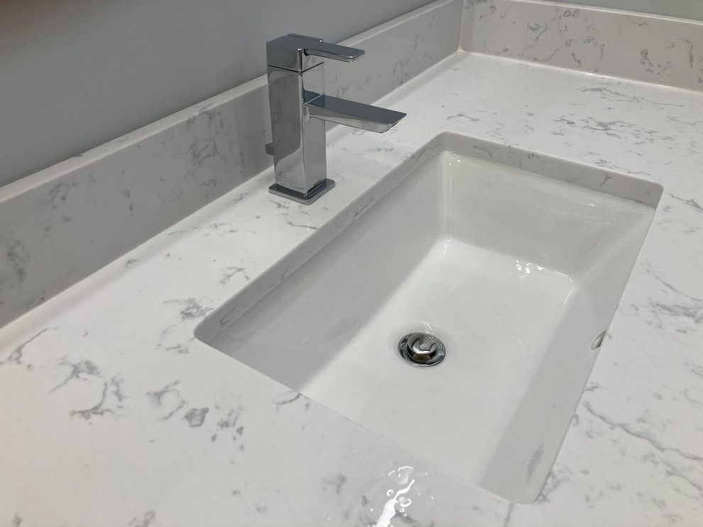 Example of a mid-sized minimalist master white tile and porcelain tile porcelain tile, gray floor and single-sink bathroom design in DC Metro with flat-panel cabinets, gray cabinets, a two-piece toilet, gray walls, an undermount sink, quartzite countertops, white countertops and a floating vanity