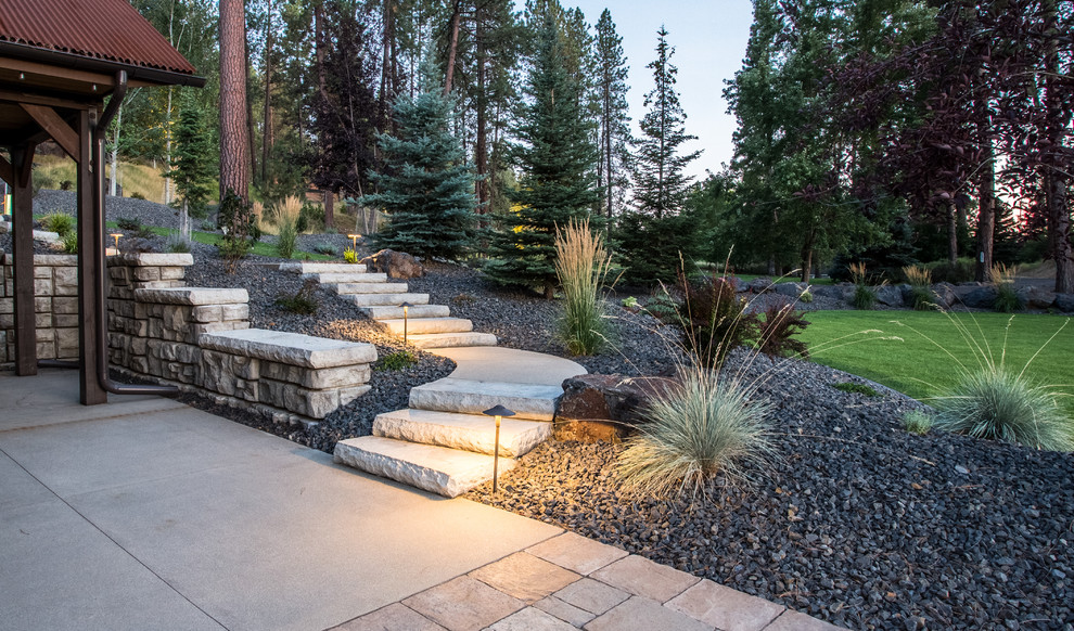 Design ideas for a large rustic concrete curved landscaping with concrete risers.