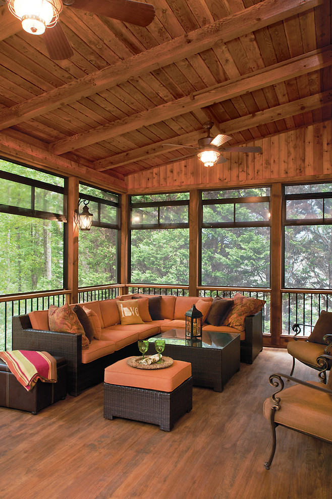 Large transitional screened-in back porch photo in Atlanta with decking and a roof extension