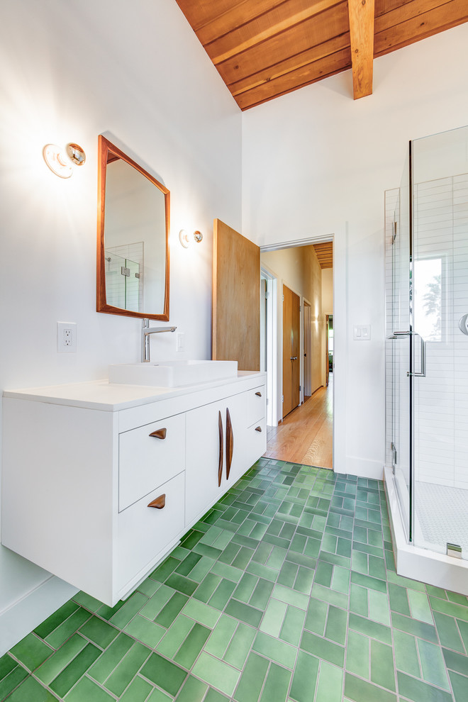 Mid-sized midcentury master bathroom in San Francisco with flat-panel cabinets, white cabinets, a corner shower, white tile, ceramic tile, white walls, ceramic floors, a vessel sink, engineered quartz benchtops, white benchtops, green floor and a hinged shower door.