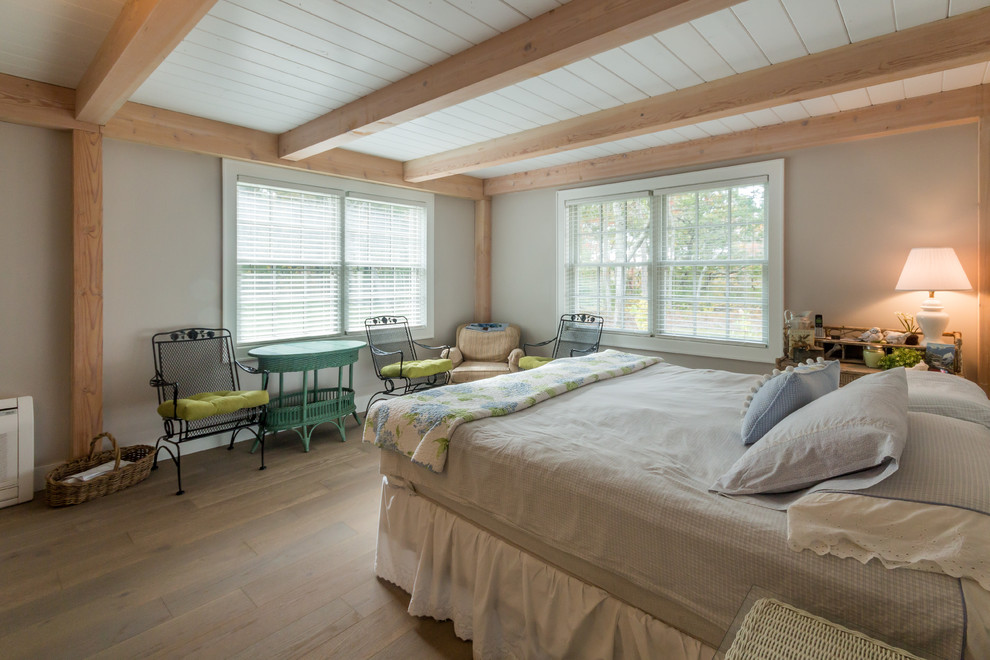 Design ideas for a traditional bedroom in Boston with grey walls and medium hardwood floors.