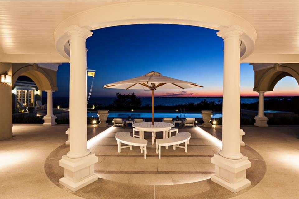 Inspiration for a large backyard tile and rectangular pool remodel in Boston