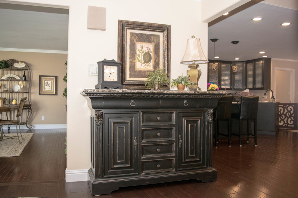 Inspiration for a mid-sized transitional dark wood floor and brown floor entry hall remodel in Sacramento with beige walls