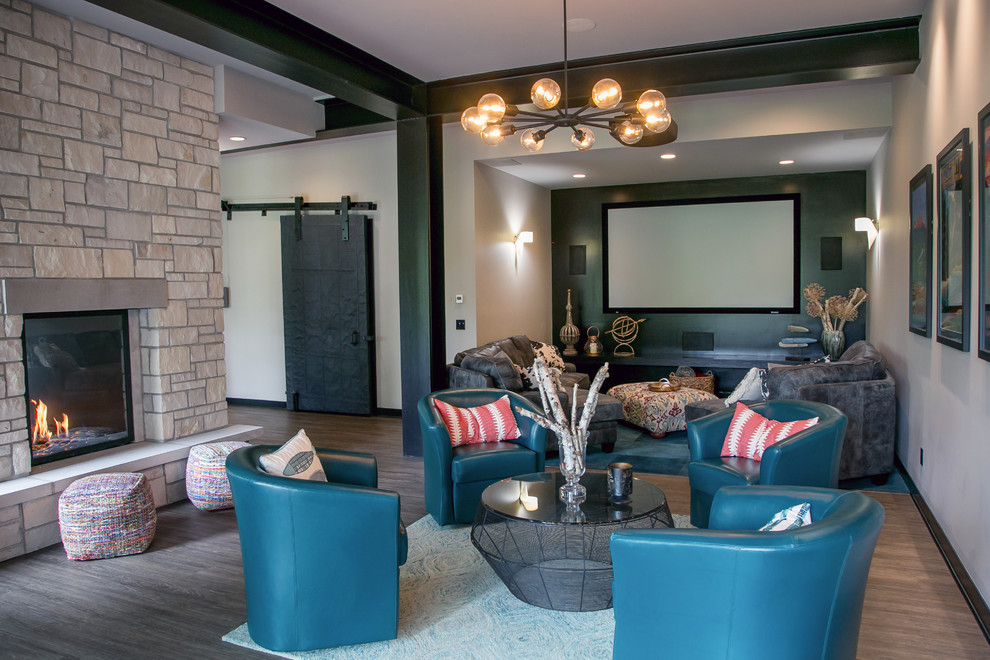 This is an example of a large contemporary open concept family room in Milwaukee with white walls, a standard fireplace, a stone fireplace surround, a wall-mounted tv, vinyl floors and grey floor.