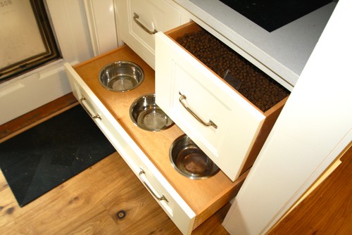 Close up of dog food storage and in drawer feeding bowls 