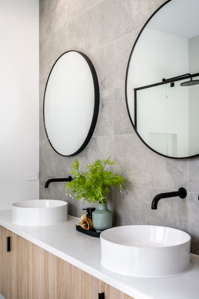 Inspiration for a mid-sized contemporary 3/4 bathroom in Adelaide with beige cabinets, gray tile, porcelain tile, white walls, grey floor, white benchtops, a double vanity and a floating vanity.