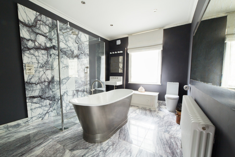 Photo of a large transitional kids bathroom in Other with a freestanding tub, an open shower, a wall-mount toilet, gray tile and black walls.