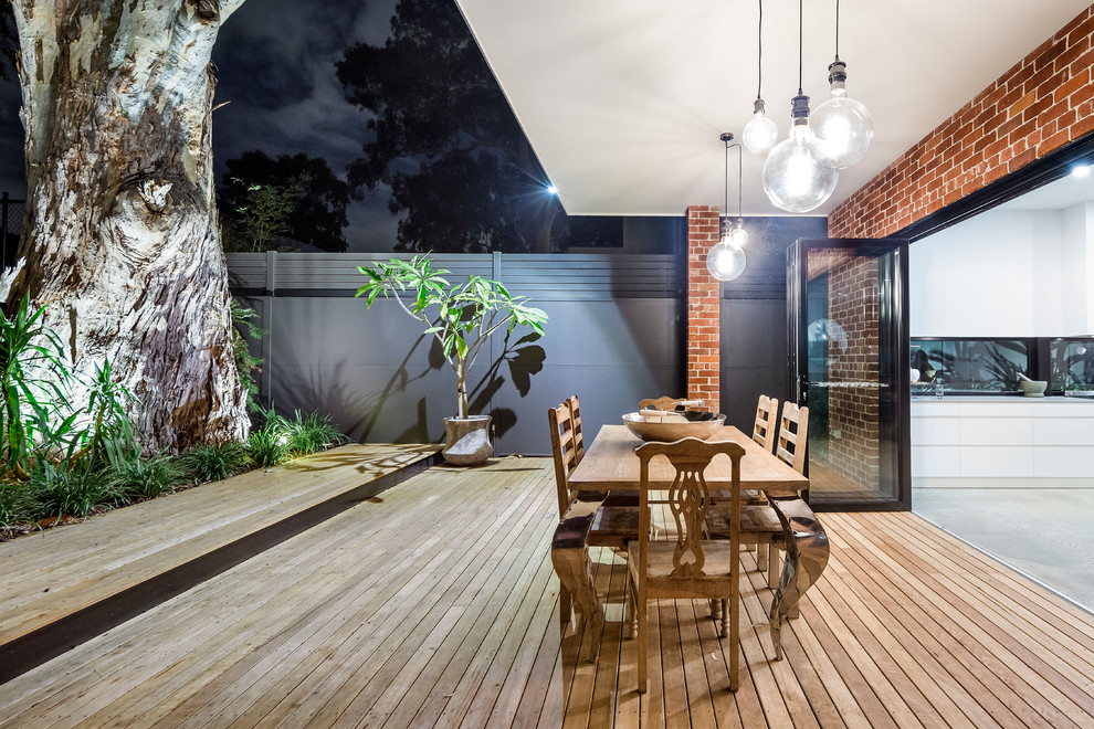 Photo of a contemporary backyard deck in Adelaide with a roof extension.