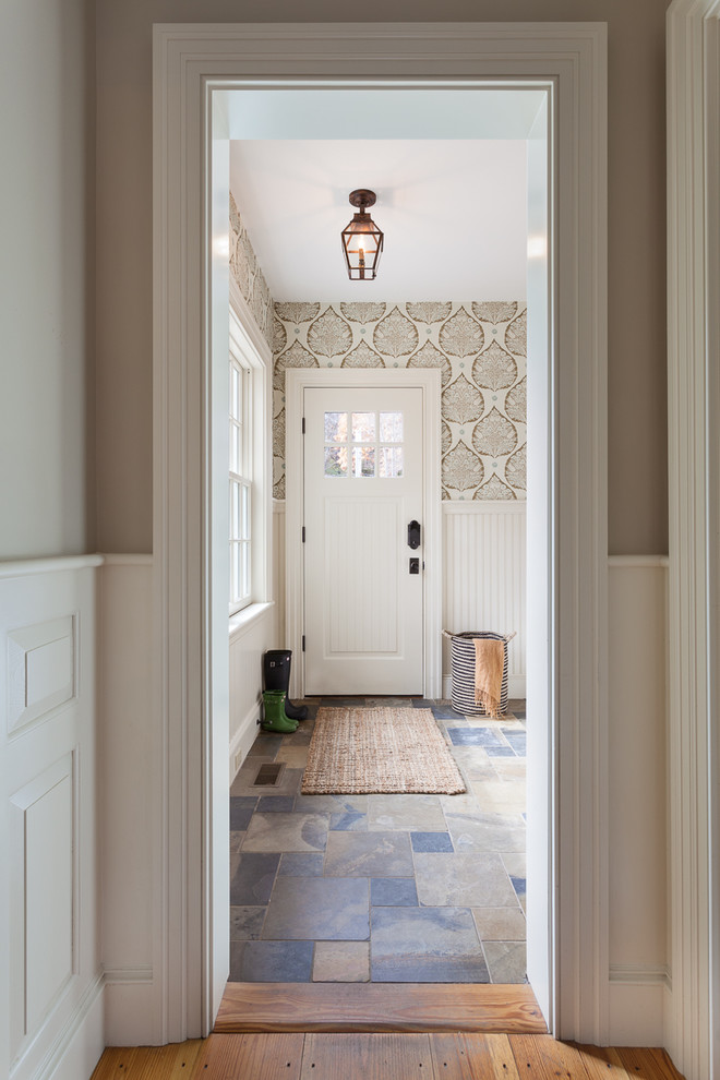 Design ideas for a small country mudroom in Boston with beige walls, slate floors and a single front door.