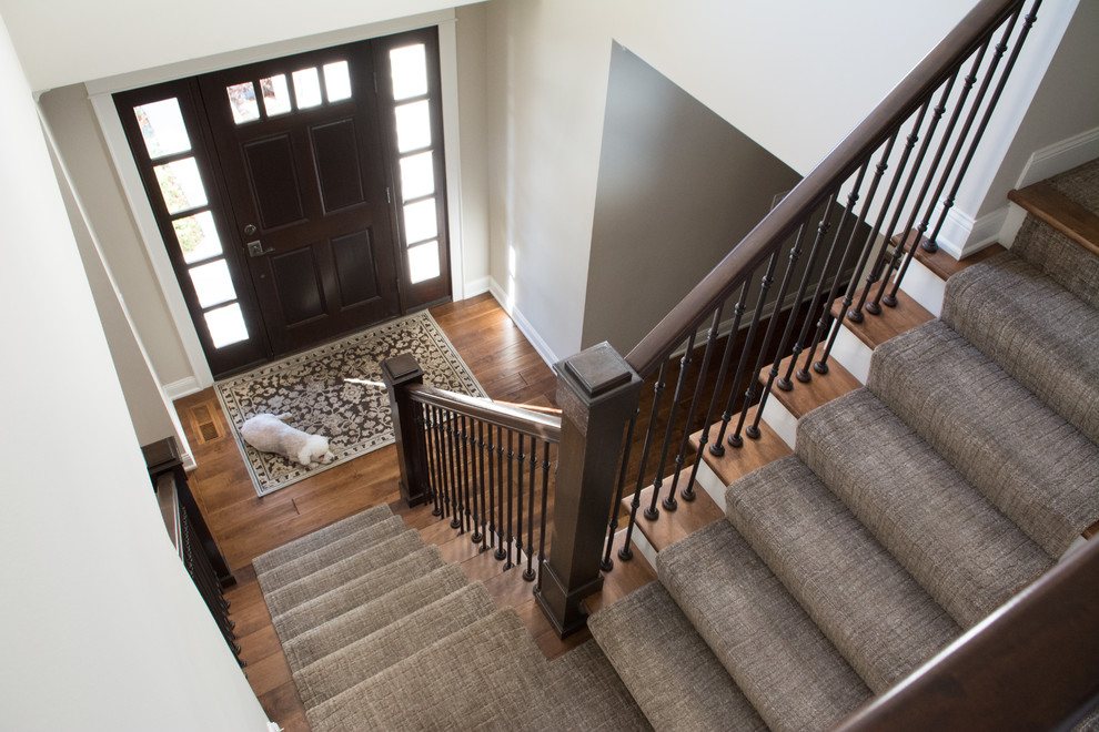 Example of a mid-sized transitional wooden l-shaped mixed material railing staircase design in Minneapolis with painted risers