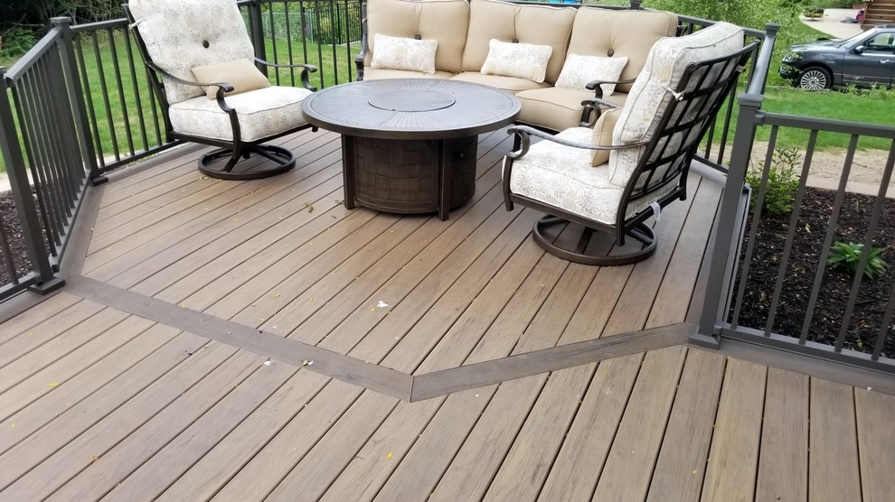 Inspiration for a large backyard deck remodel with no cover